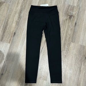 NWT renlley large black leggings. Super comfy 3/4 length. With pockets